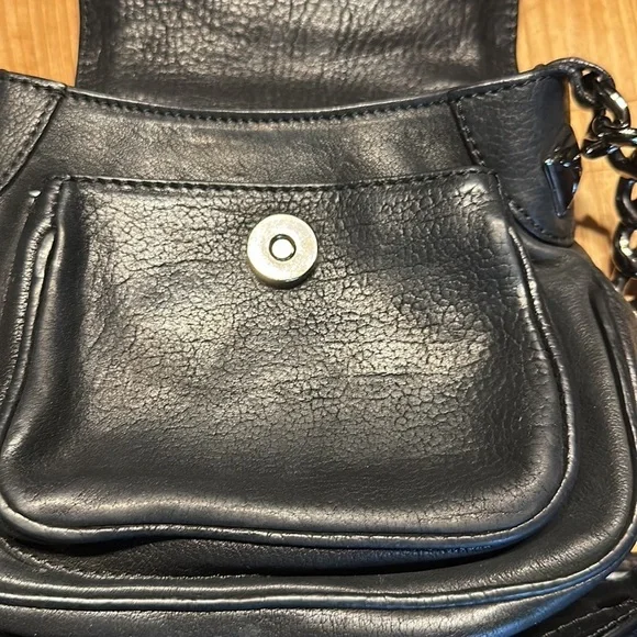 As seen in Vogue. Michael kors 2006 collection. Black studded leather.